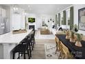 Open-concept layout, kitchen island extends to living room, creating a cozy and connected space at 7200 Hodges Meadow Ln, Charlotte, NC 28213