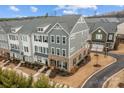 A lovely aerial view of a modern community with well-maintained landscaping and a charming street layout at 1037 Naples Dr, Davidson, NC 28036