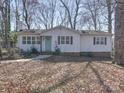 A light-colored ranch-style house with an inviting entrance and well-maintained landscaping at 10514 Lorelei Pl, Charlotte, NC 28227