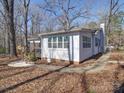 The back of the house has a wooden deck and porch at 10514 Lorelei Pl, Charlotte, NC 28227
