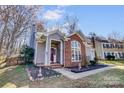Attractive single-Gathering home with manicured landscaping, walkway, and inviting front entrance at 11010 Pale Hickory Ln, Charlotte, NC 28215