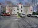 A parking lot view showcasing the front of the apartment building at 1162 W 1St St, Charlotte, NC 28202