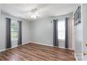 Inviting bedroom with wood-look floors, a ceiling fan, and natural light at 142 Westerwood Dr, Rock Hill, SC 29732