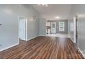 Spacious living room with wood floors flowing into a bright kitchen and a back door at 142 Westerwood Dr, Rock Hill, SC 29732