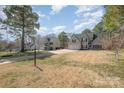 Attractive two-story house featuring a well-kept lawn and a spacious driveway at 148 Painted Bunting Dr, Troutman, NC 28166