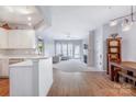 Bright and airy living room features a fireplace and opens to the kitchen at 14941 Santa Lucia Dr, Charlotte, NC 28277
