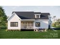 Inviting backyard featuring a covered patio, firepit, and outdoor seating area at 3701A Windy Rd # 5, Concord, NC 28027