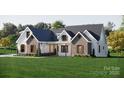 Charming home with a mix of siding and brick, complemented by a lush green lawn at 3701A Windy Rd # 5, Concord, NC 28027