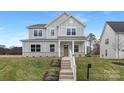 Beautiful two-story home with inviting porch, detailed trim, and manicured lawn at 3924 13Th Ne St, Hickory, NC 28601