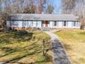 Beautiful single story home with a brick facade and a well-manicured front lawn at 549 Briarwood Ln, Lancaster, SC 29720
