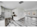 Well-lit kitchen area with stainless steel appliances and granite countertops at 613 N Pink St, Cherryville, NC 28021