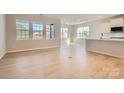 Bright and airy living space featuring hardwood floors, neutral paint, and large windows providing natural light at 8422 Norman Forest Rd, Lancaster, SC 29720