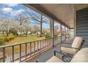 Relaxing covered porch view with comfortable seating and serene neighborhood scenery at 11924 Parks Farm Ln, Charlotte, NC 28277