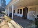 Wide covered porch with steps, offering ample space for seating and enjoying the outdoors at 1222 Sparrow Springs Rd, Kings Mountain, NC 28086