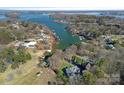 Stunning aerial view of a lakeside community, showcasing the water access and lush green surroundings at 15015 Nc Hwy 73 Hwy, Huntersville, NC 28078