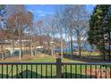 Scenic backyard view featuring lush greenery and lake access at 15015 Nc Hwy 73 Hwy, Huntersville, NC 28078