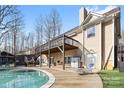 Large deck, in-ground pool, and backyard with plenty of space for outdoor entertaining at 153 Byers Rd, Troutman, NC 28166