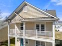 A sunlit balcony with white railings and a view of the home's exterior at 19531 Deer Valley Dr, Cornelius, NC 28031