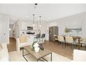 Open-concept living space featuring a modern kitchen, cozy seating area, and dining area at 2117 Gemway Dr, Charlotte, NC 28216