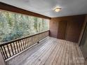 Outdoor deck with wooden floor and railings perfect for relaxing and enjoying the greenery at 2507 Kilborne Dr # H, Charlotte, NC 28205