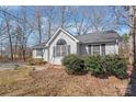 Charming single-story home featuring a well-manicured lawn, gray siding, and a classic roofline at 2913 Ashley Woods Ct, Monroe, NC 28112