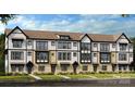 Charming new townhome with a modern design and well-manicured front lawn at 521 Annie Lowery Way, Davidson, NC 28036