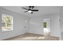 Bright living room with new flooring, fresh paint, a ceiling fan and abundant natural light at 621 E Sharpe St, Statesville, NC 28677