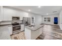 Bright kitchen with granite counters, stainless steel appliances, and an island at 834 N Flint St, Lincolnton, NC 28092