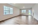 Bright and airy living room featuring hardwood floors and plenty of natural light at 8421 Norman Forest Rd, Lancaster, SC 29720