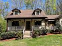 Inviting home exterior features a covered porch, perfect for enjoying the outdoors at 1496 Givens St, Hickory, NC 28602
