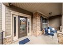 Inviting front porch features stone accents, seating area, and welcoming decor at 3019 Foggy Hollow Ln, Clover, SC 29710