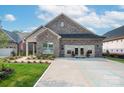 Charming brick home with a well-manicured lawn, accessible parking, and inviting double door entrance at 407 Newstyle Way # 2, Cramerton, NC 28056