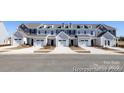 Attractive townhome featuring multiple stories and attached garage, adding convenient parking at 4170 Claret Cup Dr # 39, Kannapolis, NC 28083