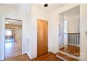 Bright foyer with hardwood floors and view into the living room and stairway, showcasing the home's layout at 4456 Carriage Drive Cir, Charlotte, NC 28205