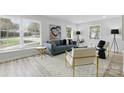 Bright living room with large windows, comfortable seating, and stylish decor at 4913 Seacroft Rd, Charlotte, NC 28210