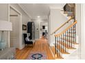 Inviting foyer with hardwood floors, staircase, and elegant decor at 7924 Pemswood St, Charlotte, NC 28277