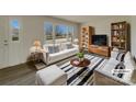 Bright living room with large window, stylish furnishings, and contemporary decor at 8103 Idlewild Rd, Indian Trail, NC 28079