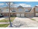 Attractive townhome complex featuring private garages and well-maintained landscaping at 8513 Loxton Cir, Charlotte, NC 28214