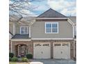 Charming home featuring a brick facade and a two-car garage, creating an inviting curb appeal at 8513 Loxton Cir, Charlotte, NC 28214