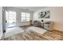 Bright foyer with wood floors, neutral paint, and a front door opening at 8929 Bryant Field Cir, Charlotte, NC 28277