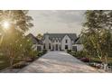 Stunning exterior view of a two-story home with a stone driveway and manicured landscaping at 1025 Maxwell Ct # 7, Marvin, NC 28173