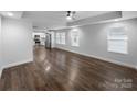 Open-concept living room showcasing the hardwood floors and natural light at 118 W Lee Ave, Bessemer City, NC 28016