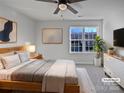 Cozy bedroom with soft carpet, neutral tones, and a ceiling fan at 121 Woodbridge Cir, Mount Holly, NC 28120