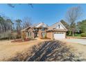 Beautiful brick home showcasing its manicured lawn and elegant architectural design at 143 Shoreview Dr # 7, Mooresville, NC 28117