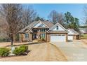 Charming brick home with a well-maintained lawn and attached two car garage at 143 Shoreview Dr # 7, Mooresville, NC 28117
