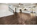 Spacious open-concept living space with hardwood floors and staircase at 144 Tetcott St, Mooresville, NC 28115