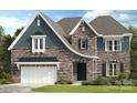 Stunning stone two story home with a manicured lawn and attached two car garage at 3017 Tramore Dr, Harrisburg, NC 28075