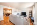 Bright living room with hardwood floors, neutral decor, and seamless access to the dining area at 3415 23Rd Ne St, Hickory, NC 28601