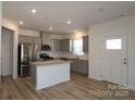 Bright kitchen features stainless steel appliances, granite countertops, and a kitchen island at 4005 Lawnview Dr, Charlotte, NC 28269