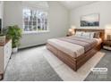 Primary bedroom with large window, natural light and neutral tones at 4627 Avalon Forest Ln, Charlotte, NC 28269
